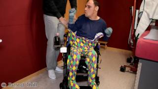 Strampler im Rollstuhl anziehen Guy with infantile cerebral palsy puts on romper suit  wheelchair [upl. by Ecertap524]