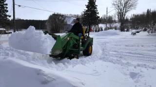 John deere 1026r cold start and loader snow removal [upl. by Lammond]