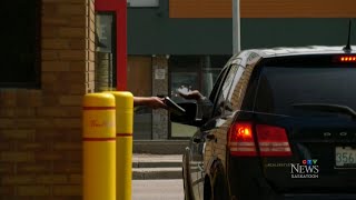 Driver in Sask ticketed by police for using foodordering app on phone in drivethru line [upl. by Durante]