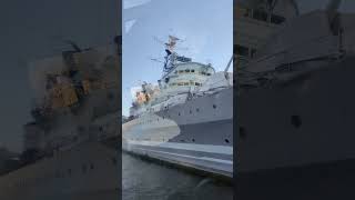 HMS Belfast battleship on the River Thames next to tower Bridge opposite tower of London [upl. by Joane]