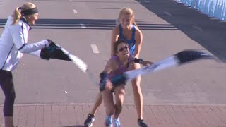 Stranger Carries Woman to Marathon Finish Line [upl. by Nahtanha]