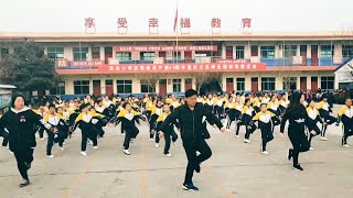 Watch China school principal joins students for shuffle dance [upl. by Leuqram862]