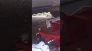 using a transmission jack to install a trailer hitch [upl. by Eirolam]