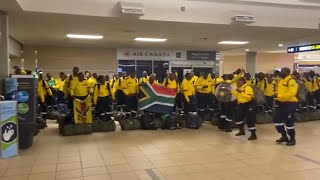 South African firefighters sing and dance after arriving at Edmontons airport [upl. by Bywaters]