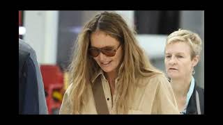 Elle Macpherson is all smiles as she arrives back in Sydney after sparking debate by revealing she u [upl. by Yaj]