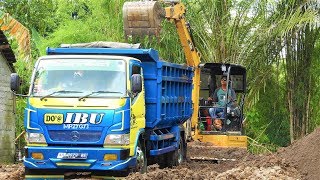 Mini Bagger Excavator Digging Loading Dirt Into Dump Truck CAT 304E CR [upl. by Amesari]