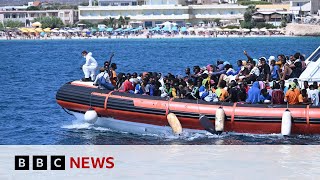 Lampedusa 7000 migrants arrive on Italian island in three days  BBC News [upl. by Amadeo]