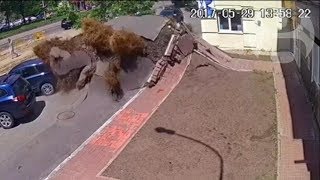 Underground water pipe explosion destroys road in Ukraine [upl. by Elleynod503]