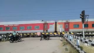 The Red Train thrashes a Level crossingIndian Railways YPR GKP Exp [upl. by Fredkin]