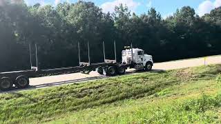 Freightliner Cascadia Freightliner day cab Freightliner Columbia 120 hauling empty log trailer [upl. by Adnahsor]