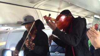 Surprise InFlight Performance on US Airways by Black Violin [upl. by Atinahs]