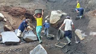 process of miners digging sand on a cliff and load it into the truck [upl. by Cirre562]