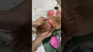 Person is showing how doll heads get their hair [upl. by Phedra]