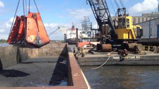 Dockside dredging with 16 cy level cut bucket [upl. by Enenaj]