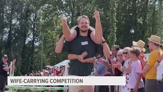 Scandinavian festival features wife carrying event [upl. by Lapham]