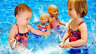 Kids play baby dolls Baby Annabell Mermaid at the swimming pool Mommy for Lucky Family fun video [upl. by Ajup]