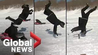 Reporter flipped by sled during news report OFFICIAL VIDEO [upl. by Pollux]