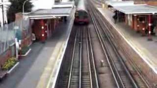 Central line train leaving Theydon Bois tube station [upl. by Sergent]