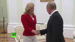 Russia Croatian president gives Putin personalised national team jersey [upl. by Anilrac]