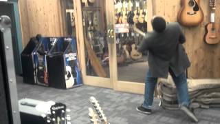 Guy losses it at guitar center south bay [upl. by Norrabal]