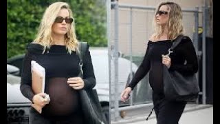 Margot Robbie puts her growing baby bump on display in sheer top while out in LA [upl. by Roderick]