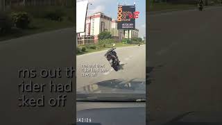 Riderless Motorcycle Swerves into Highway Lane in Malaysia [upl. by Philender]