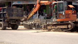 The Hitachi Zaxis 75 excavator works to collect the excavated soil to be loaded onto the truck [upl. by Adnala622]