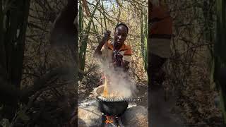 Hadzabe Tribe women prepare delicious bush food in forest each day to feed the tribe members [upl. by Lemar]