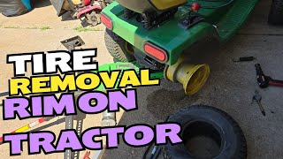 160 John Deere tractor tire removal with rim on tractor [upl. by Anik]