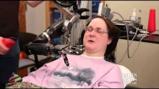 Robot arm controlled by brain of quadriplegic woman [upl. by Yelir]