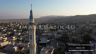 Aerial view over Jericho City and Mosque tower [upl. by Akialam]