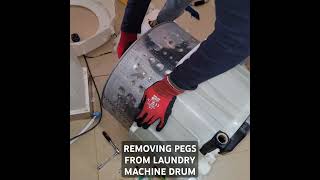 REMOVING PEGS FROM LAUNDRY MACHINE DRUM subscribe laundry homeappliance repair [upl. by Azpurua]