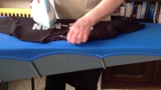 Ironing a t shirt to be folded [upl. by Yeslehc]