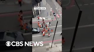 Man confronts climate activists blocking traffic in London shoving them and ripping banners shorts [upl. by Miche]