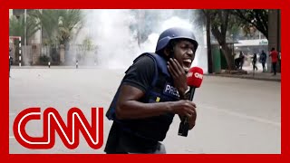 CNN reporter hit by fragment of tear gas canister while reporting on Kenya protests [upl. by Kcirdneked608]