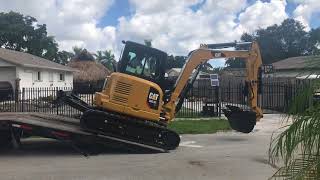 Cat 3055e2 CR unloading from trailer [upl. by Punke]