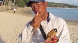 Thai quotwodequotflute wind instrument played on beach [upl. by Nauqad]