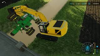 FS 22 RESCUE A JD SPREADER IN THE DITCH ON ITS SIDE WITH A TRACK HOE AND A 60 TON ROTATOR [upl. by Anniken229]