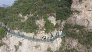 Breathtaking Ushaped Glass Skywalk Opens in Central China [upl. by Marigold]