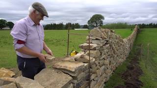 How to Build a Retaining Wall from Stone without Mortar [upl. by Aneerb]