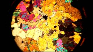 A thin section viewed through a petrographic microscope with stage rotation [upl. by Chem967]