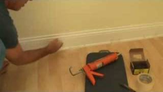 Installing baseboard trim to a concrete wall [upl. by Tolman]