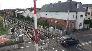 SWR Class 701 passes Egham Level Crossing  11082023 [upl. by Girardi]