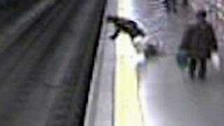 Fainting woman falls on train tracks [upl. by Limaa]