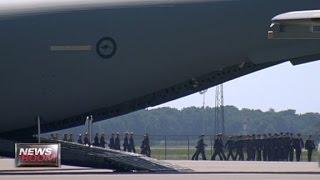 First MH17 bodies arrive in Netherlands [upl. by Ymorej238]