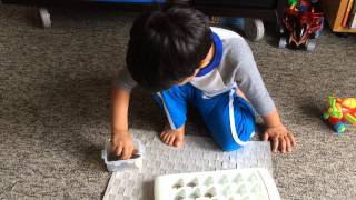 Moksh in a Montessori Fine Motor Skills Activity Transferring Coins with Tweezers [upl. by Chae]