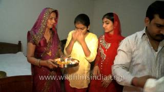 Indian family praying together on Diwali festival [upl. by Namolos]