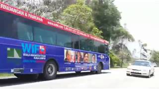 Morinosuke Kawaguchis face on buses advertising the World Innovation Forum Kuala Lumpur 2013 [upl. by Aciram]