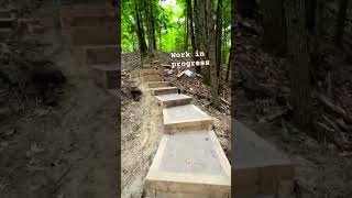 Big crib staircase in the woods workinprogress construction trailbuilding [upl. by Kciremed]