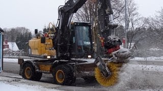 Volvo EW140C sweeping snow [upl. by Neila719]